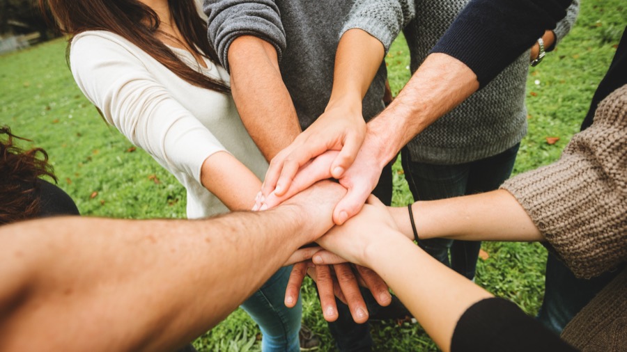Volunteers joining hands
